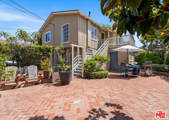 a view of a chairs and tables in the patio