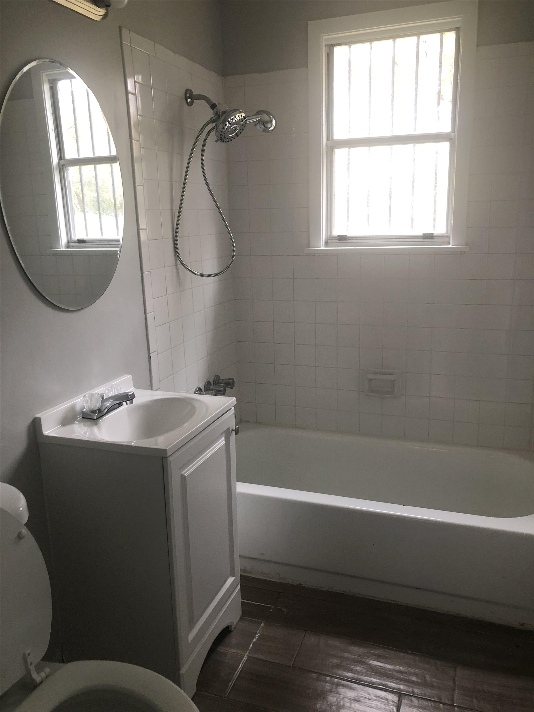 1698 Rayner Street Memphis, TN 38106 - Photo 5 of 8 a bathroom with a sink toilet and shower