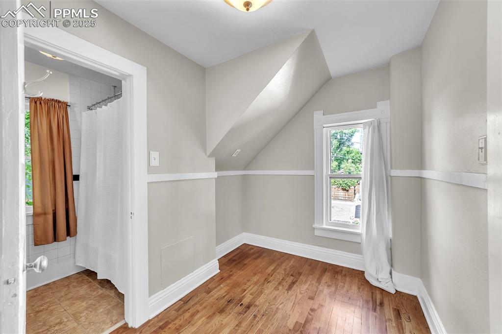 319 South Institute Street Colorado Springs, CO 80903 - Photo 27 of 49 an empty room with wooden floor and windows