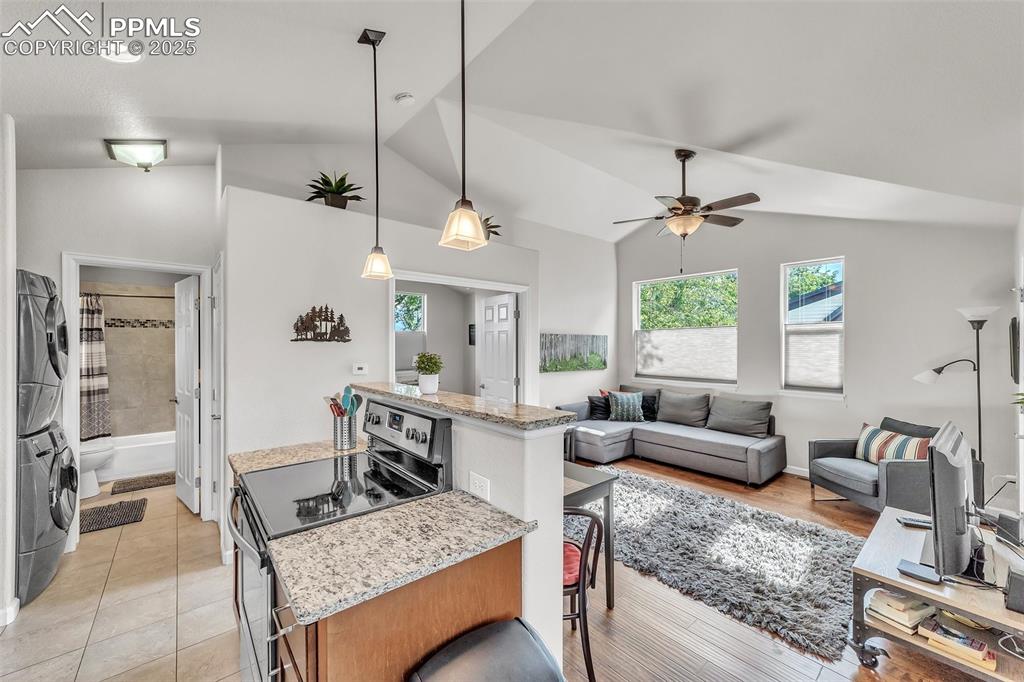 319 South Institute Street Colorado Springs, CO 80903 - Photo 30 of 49 a living room with furniture and a chandelier