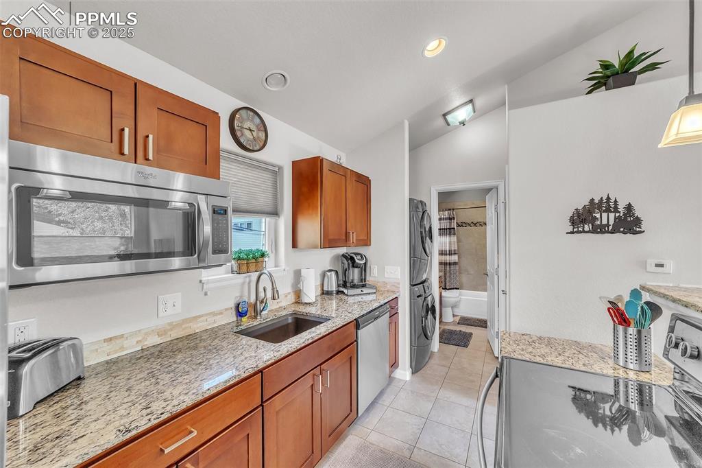319 South Institute Street Colorado Springs, CO 80903 - Photo 31 of 49 a kitchen with stainless steel appliances granite countertop a sink and cabinets
