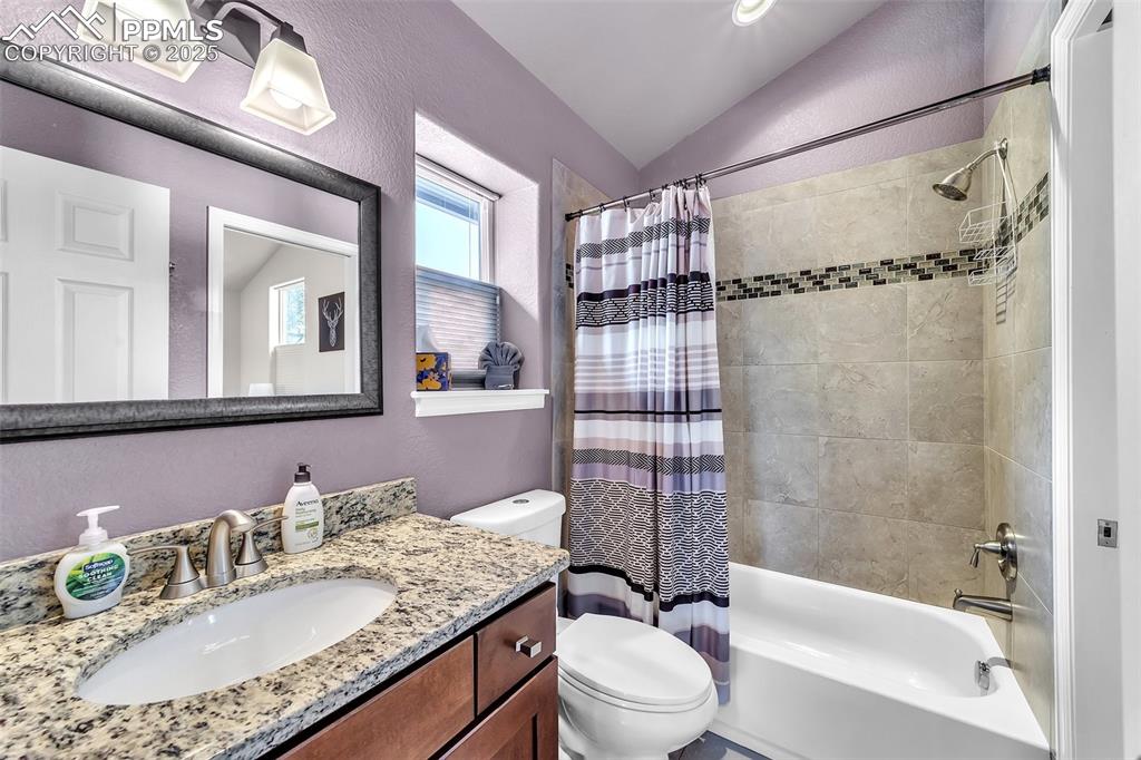 319 South Institute Street Colorado Springs, CO 80903 - Photo 35 of 49 a bathroom with a granite countertop sink toilet mirror and shower