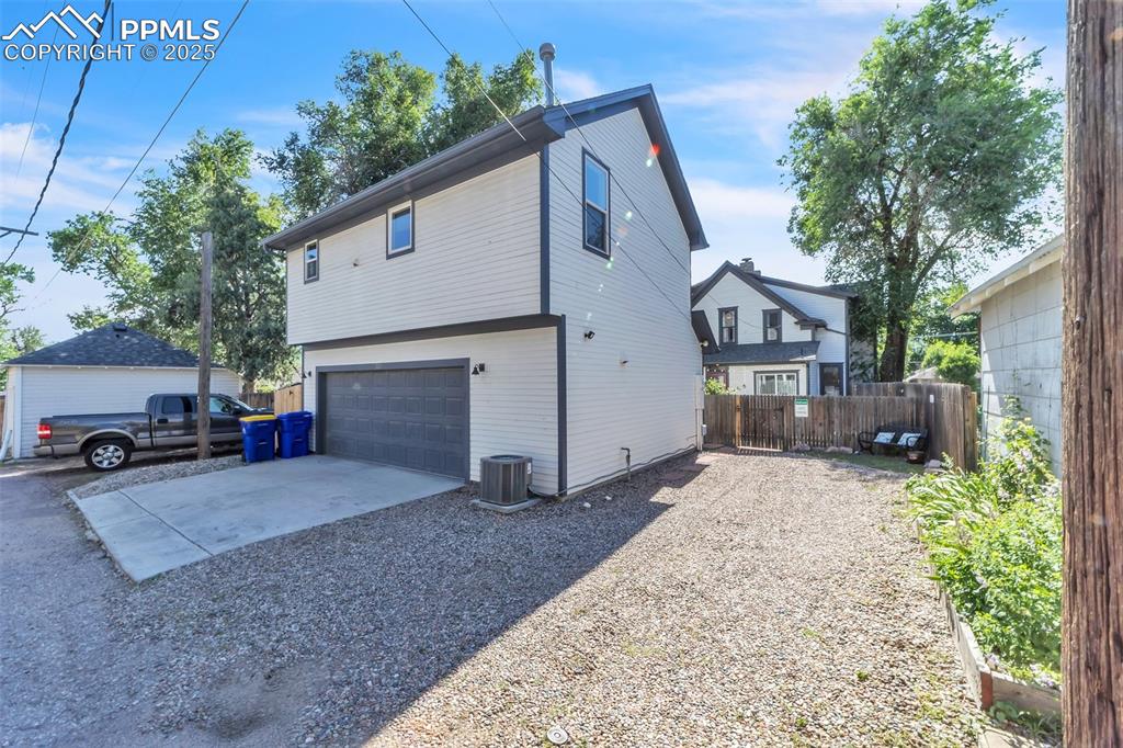 319 South Institute Street Colorado Springs, CO 80903 - Photo 41 of 49 a view of a house with a yard and garage