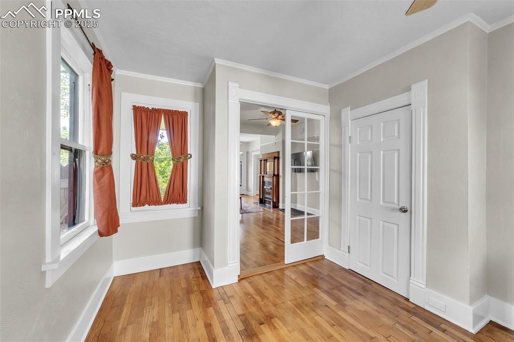 319 South Institute Street Colorado Springs, CO 80903 - Photo 7 of 49 wooden floor in an empty room with a window
