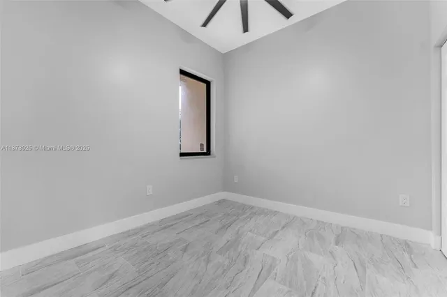 a bathroom with a toilet and a bathtub