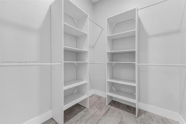 a bathroom with a sink a mirror and shower