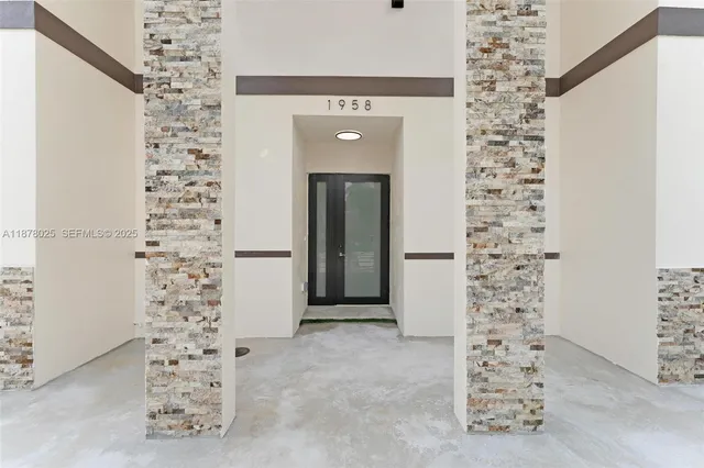 a view of a livingroom with wooden floor and stairs