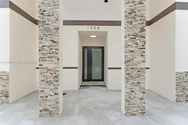 a view of a livingroom with wooden floor and stairs