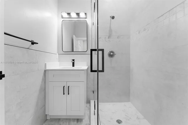 a view of a backyard with potted plants and wooden fence