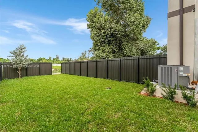 a view of a lake with beach and city view