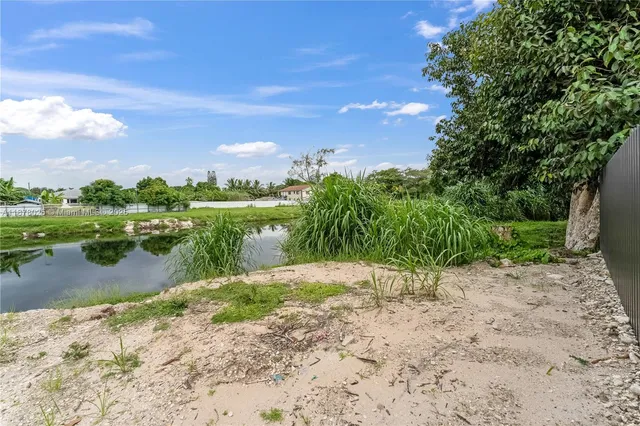 an aerial view of a house with a garden