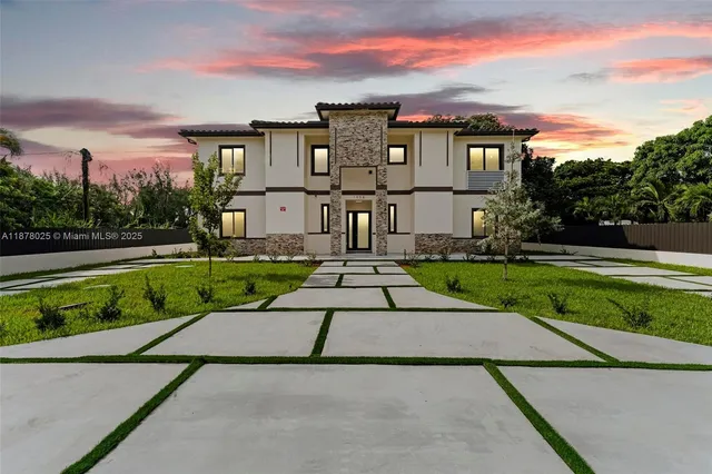 an aerial view of residential house with outdoor space and lake view