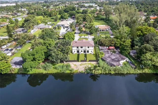 an aerial view of a city with mountains