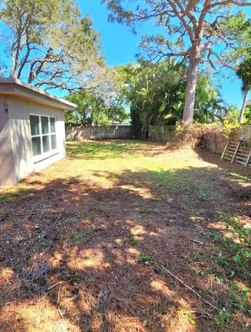 a view of house with yard