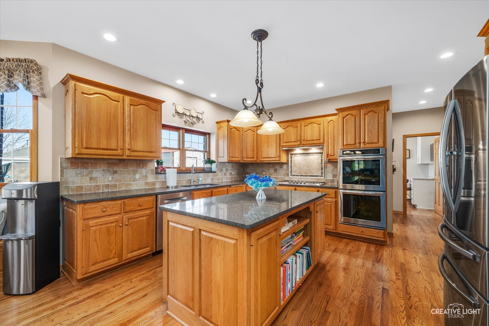1651 Johnson Road Oswego, IL 60543 - Photo 5 of 60 a kitchen with stainless steel appliances granite countertop a stove and refrigerator