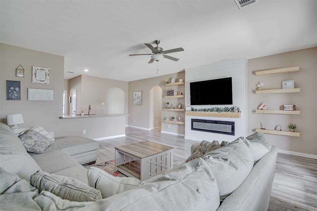 1813 Rialto Lane Crowley, TX 76036 - Photo 14 of 27 a living room with furniture and a flat screen tv