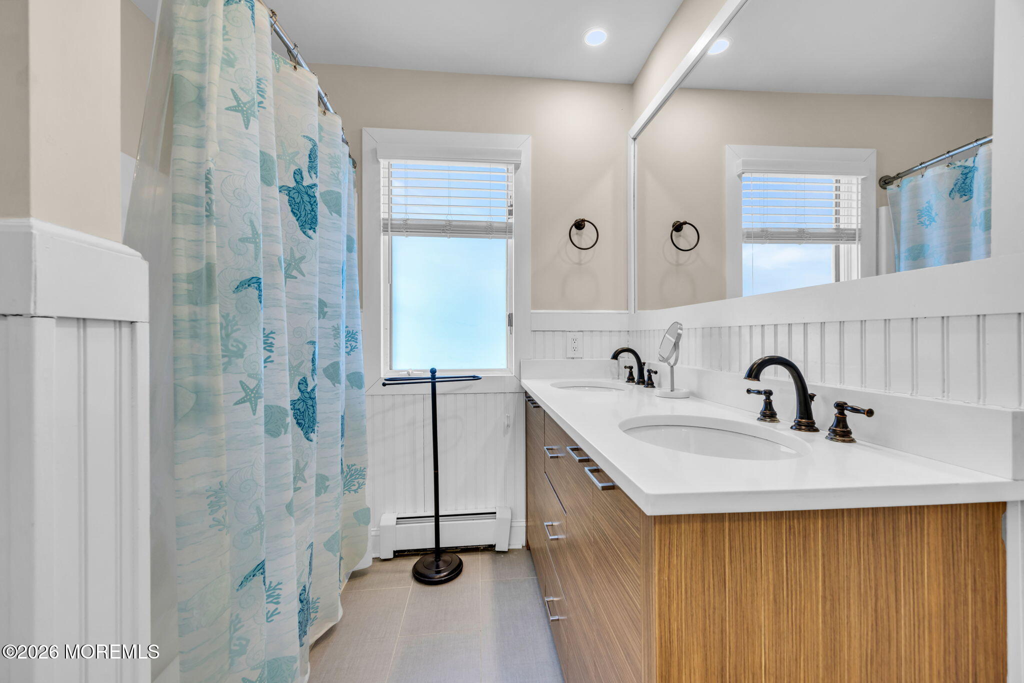 211 Forman Avenue Point Pleasant Beach, NJ 08742 - Photo 12 of 69 a bathroom with a sink and a mirror