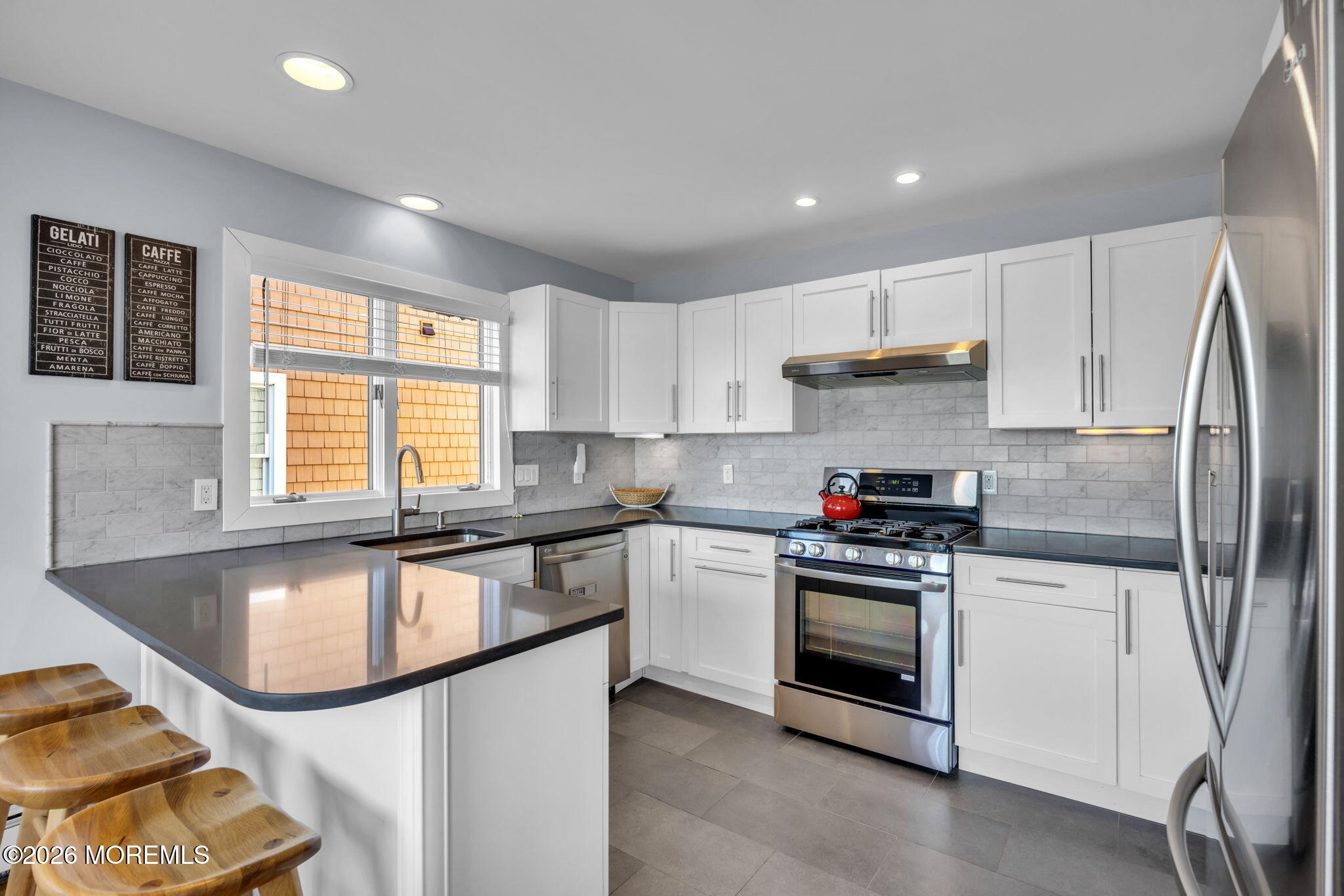 211 Forman Avenue Point Pleasant Beach, NJ 08742 - Photo 18 of 69 a kitchen with granite countertop a stove sink and refrigerator