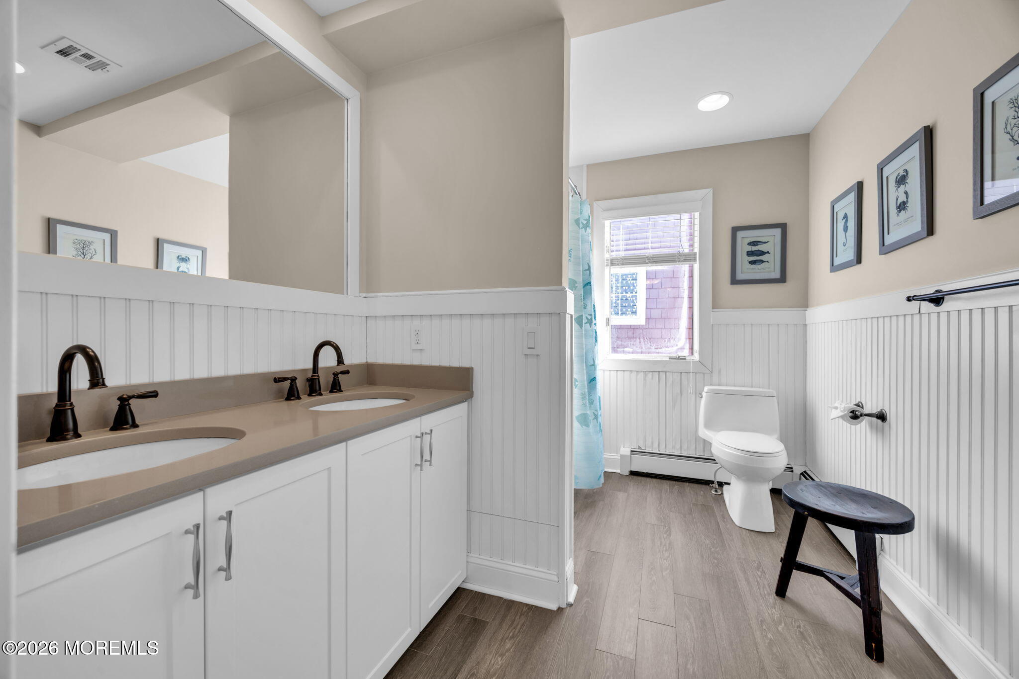 211 Forman Avenue Point Pleasant Beach, NJ 08742 - Photo 27 of 69 a bathroom with a double vanity sink a mirror and a toilet