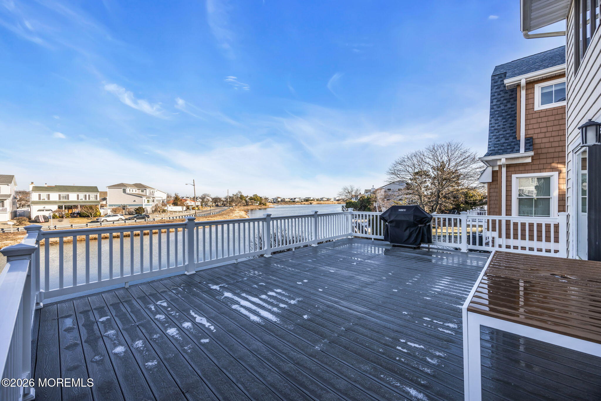 211 Forman Avenue Point Pleasant Beach, NJ 08742 - Photo 37 of 69 a view of a roof deck with table and chairs a barbeque with wooden floor and fence