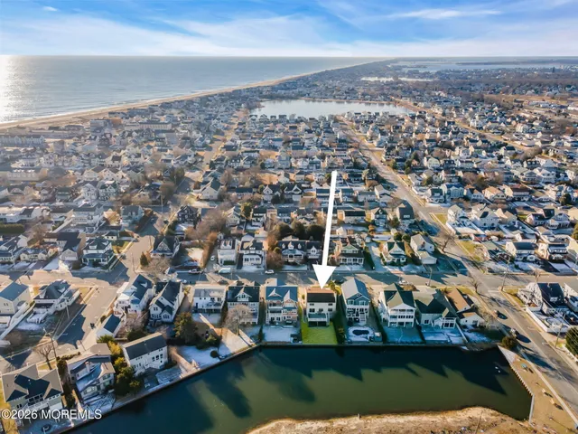 an aerial view of a city with ocean view
