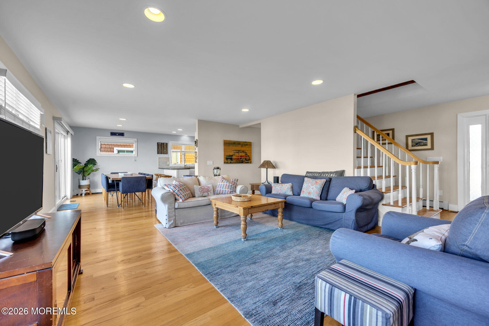 211 Forman Avenue Point Pleasant Beach, NJ 08742 - Photo 9 of 69 a living room with furniture a wooden floor and a flat screen tv