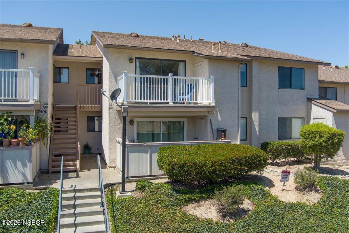 3400 Santa Maria Way, Unit 207B Santa Maria, CA 93455 - Photo 2 of 50 a front view of a house with a yard