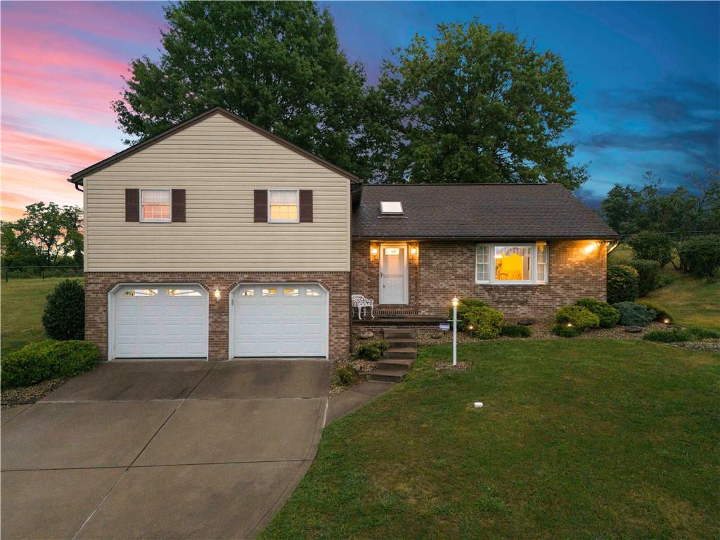 a view of house and outdoor space with yard