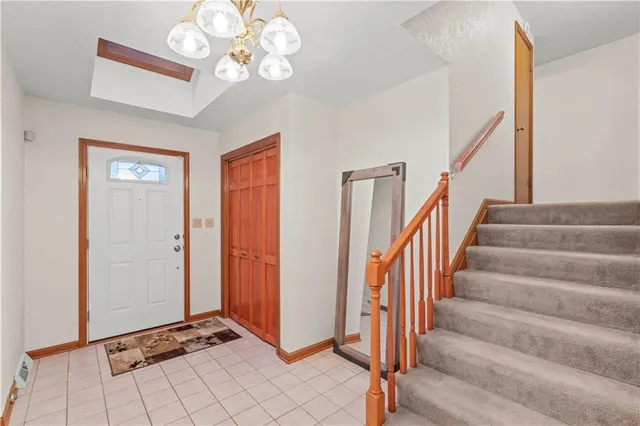 a view of an entryway with front door