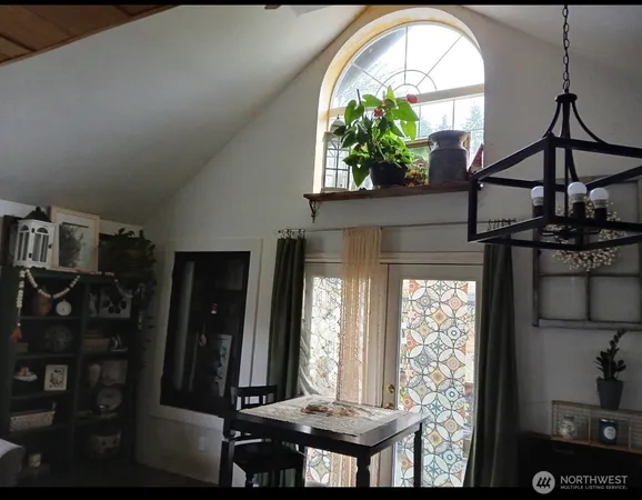a view of entryway with a front door and wooden floor