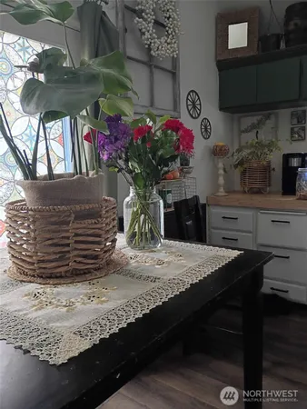 a table of wine sitting next to a wooden floor