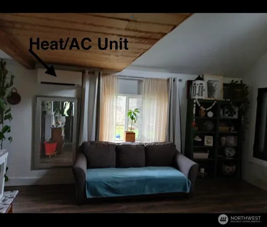 a view of living room with furniture and floor to ceiling window