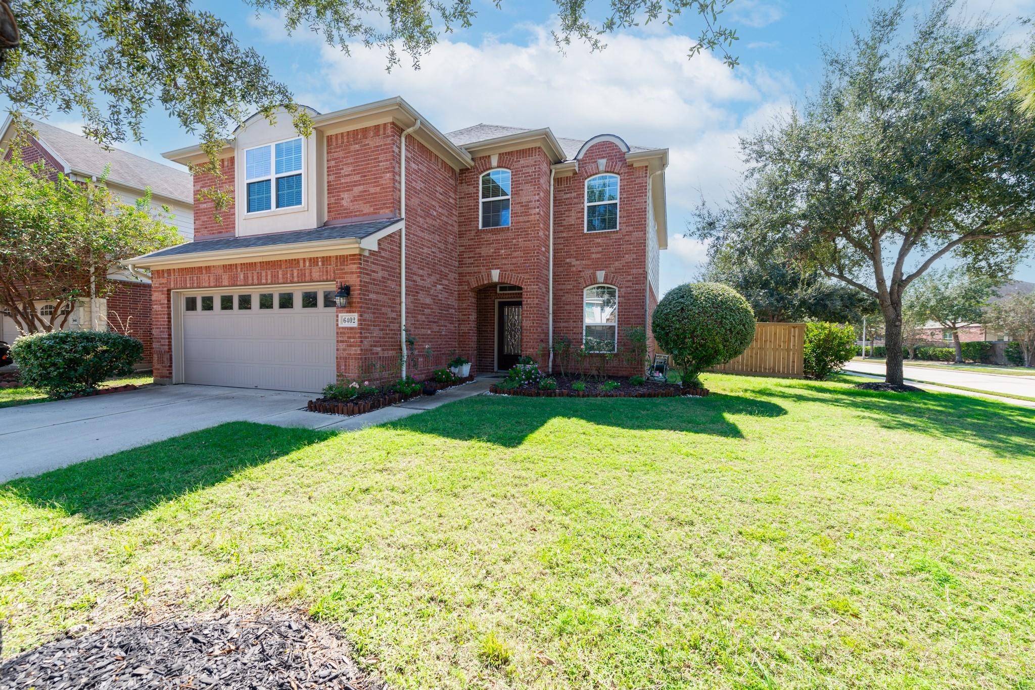 Beautiful two-story brick home situated on a spacious corner lot in the heart of Cinco Ranch. Enjoy the convenience of being just one block from a neighborhood park, along with professional lawn maintenance included in the rent for truly carefree living. Mature trees, attractive landscaping, and excellent curb appeal make this home a standout.