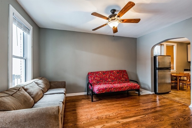 1114 West Cullerton Street, Unit 1 Chicago, IL 60608 - Photo 4 of 10 a bedroom with furniture and a window