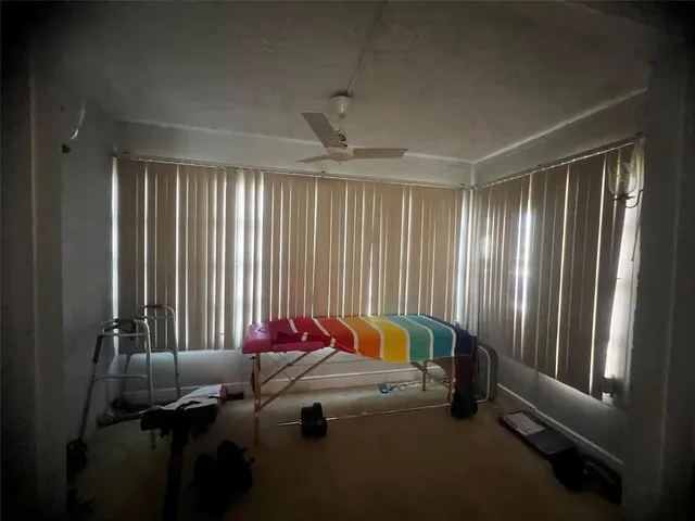 a bed room with a bed and a window