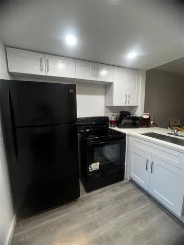 a kitchen with a sink and a stove