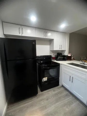 a kitchen with a sink and a stove