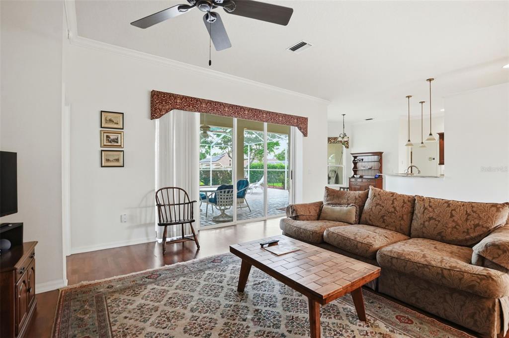 14228 Presteign Lane Spring Hill, FL 34609 - Photo 19 of 89 a living room with furniture and a window