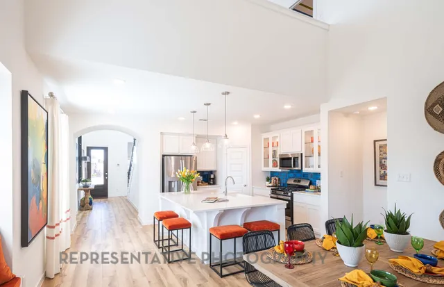 a living room with lots of furniture and decor
