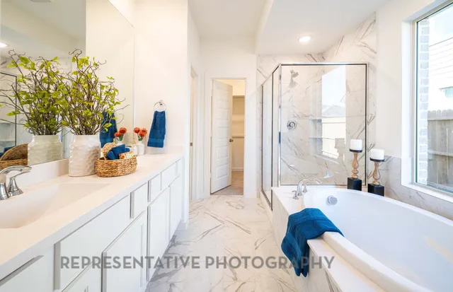 a bathroom with a tub sink and mirror