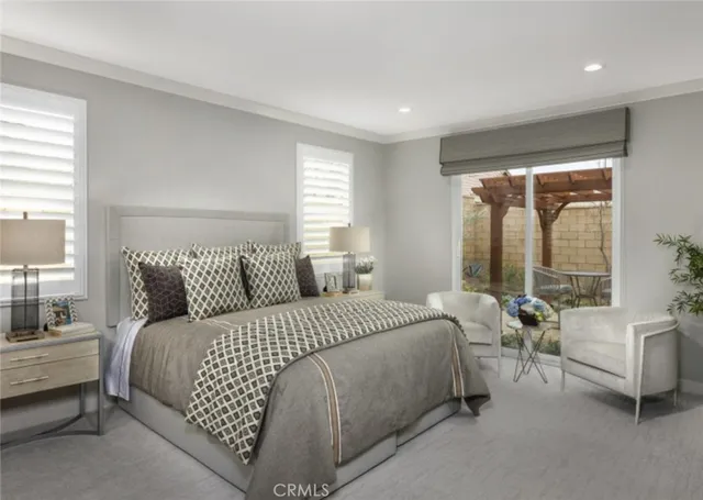 a bedroom with a bed and a couch