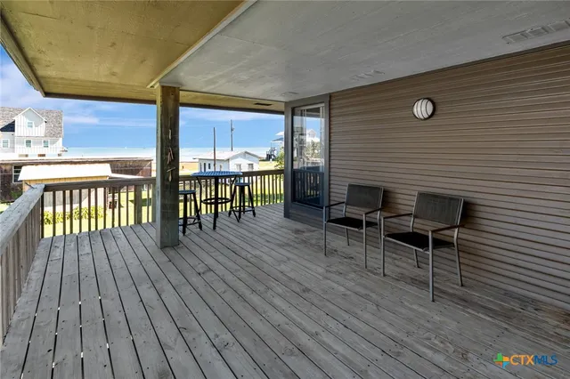 a view of a chairs on the deck