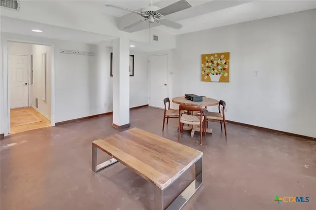 a living room with furniture and a table