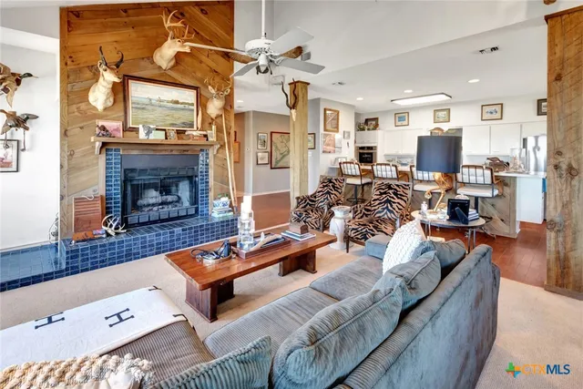 a living room with furniture and a fireplace