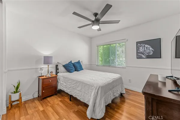 a bedroom with a bed and a desk