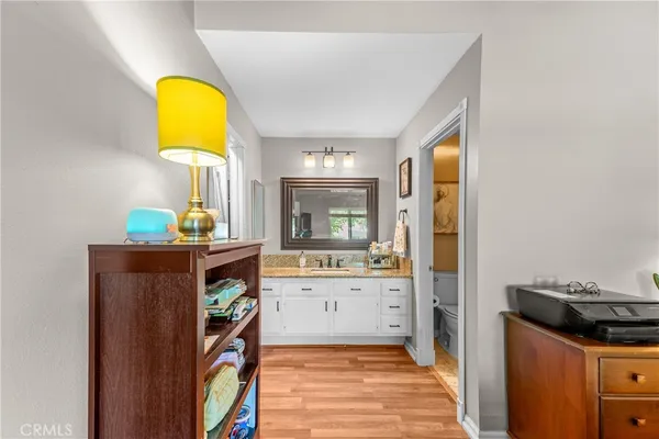 a view of kitchen and wooden floor