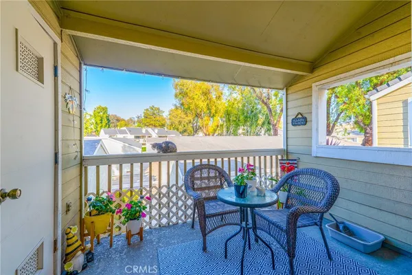 a view of a chairs and table in a patio