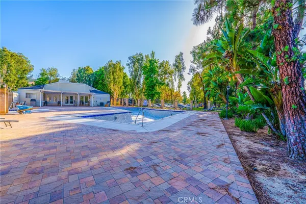 a view of house with yard and entertaining space