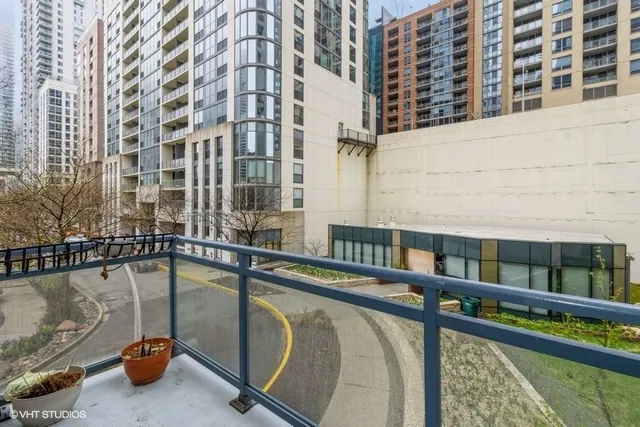 a view of a balcony with chairs