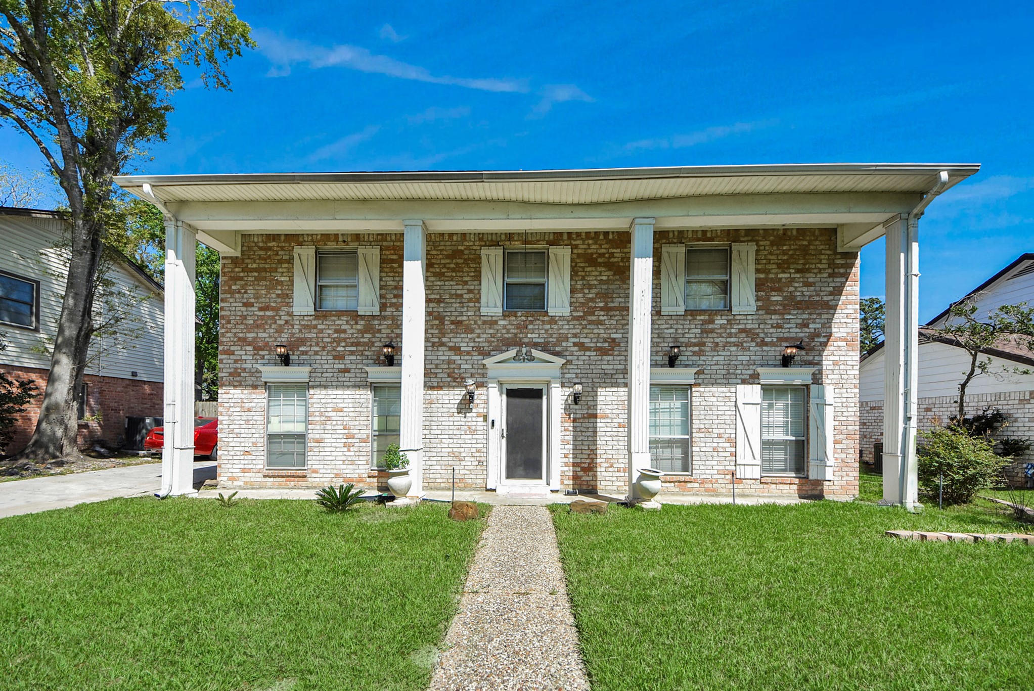 1011 Whitestone Lane Houston, TX 77073 - Photo 3 of 48 front view of a house with a yard